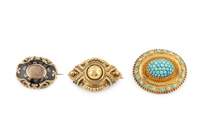 Lot 56 - Three Victorian panel brooches, the first...