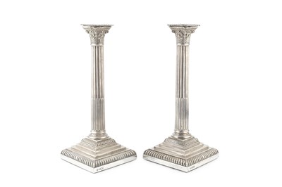 Lot 641 - A pair of Edwardian silver candlesticks, of...