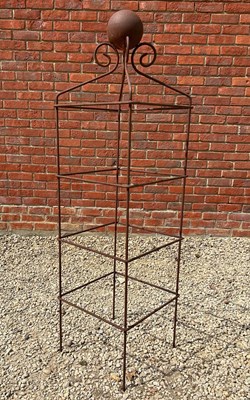 Lot 1311 - A square scroll obelisk plant support