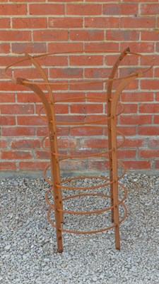 Lot 1326 - A hand-forged iron tree guard or plant support