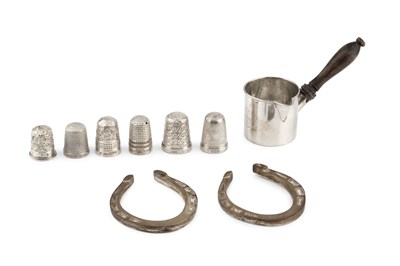 Lot 566 - A pair of George VI silver horseshoes, each...