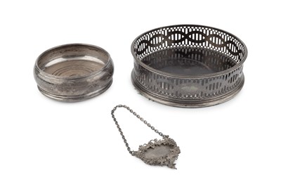Lot 631 - A George III silver bottle coaster, with...