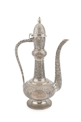 Lot 666 - A middle Eastern silver ewer, of slender...