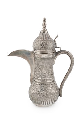 Lot 667 - An Omani white metal dallah, of baluster form...