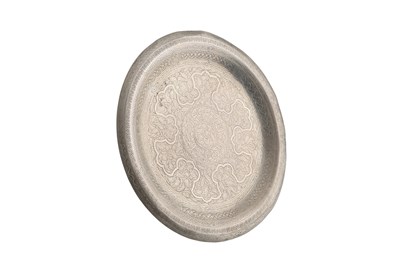 Lot 671 - An Egyptian silver plate, engraved with...