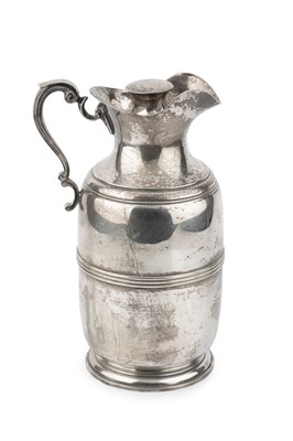 Lot 675 - A silver hot water jug, with reeded body,...