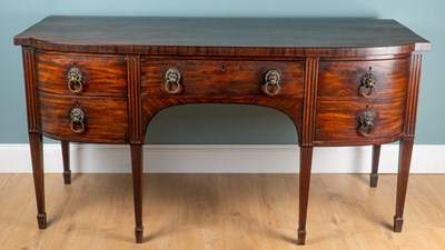Lot 1040 - A Georgian mahogany bow-fronted sideboard
