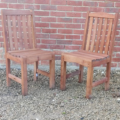Lot 1421 - A pair of teak garden chairs by Lister
