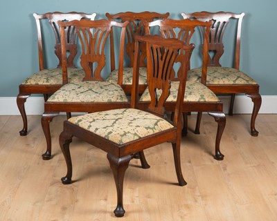Lot 1325 - A set of twelve mahogany Chippendale-style dining chairs