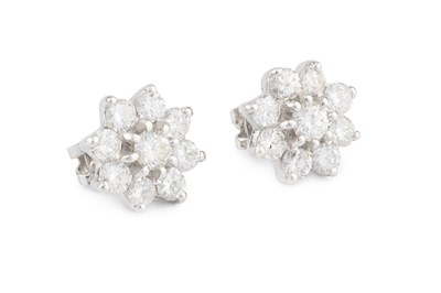 Lot 220 - A pair of diamond and white stone cluster ear...