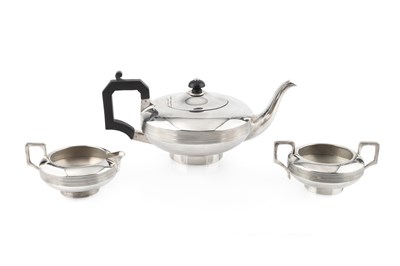 Lot 700 - A George V silver three piece tea service, of...