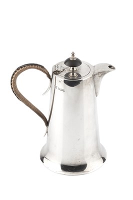 Lot 701 - A George V silver hot milk pot, of tapering...