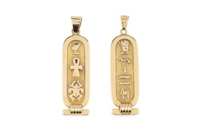 Lot 67 - Two Egyptian cartouche pendants, yellow...