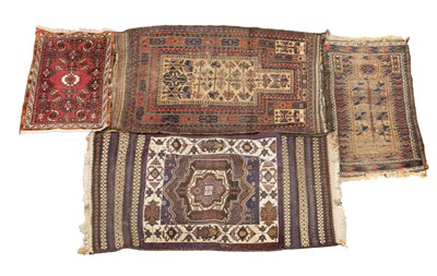 Lot 1270 - A collection of four rugs