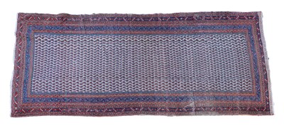 Lot 1101 - An early 20th century hand-woven Caucasian hall carpet