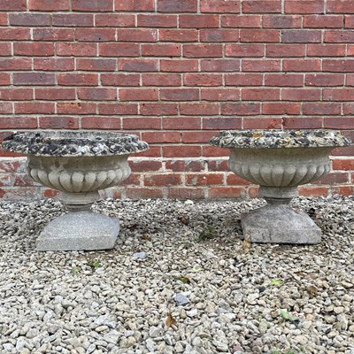 Lot 1406 - A pair of cast composite garden urns