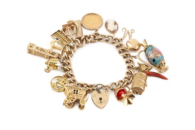 Lot 12 - A charm bracelet, the curb-link bracelet...