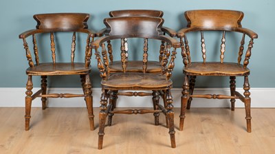 Lot 1237 - A harlequin set of four smokers' chairs