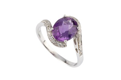 Lot 80 - An amethyst and diamond dress ring, of...