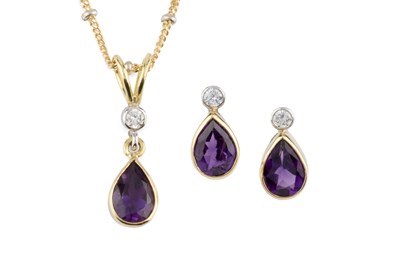 Lot 79 - An amethyst and diamond pendant and ear studs...