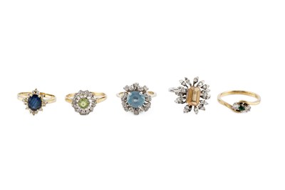 Lot 402 - A collection of gem set dress rings,...