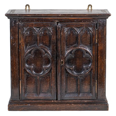 Lot 1037 - A small 17th century and later oak wall cupboard