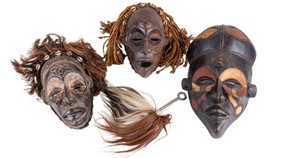 Lot 1162 - Three West African woodcarved masks