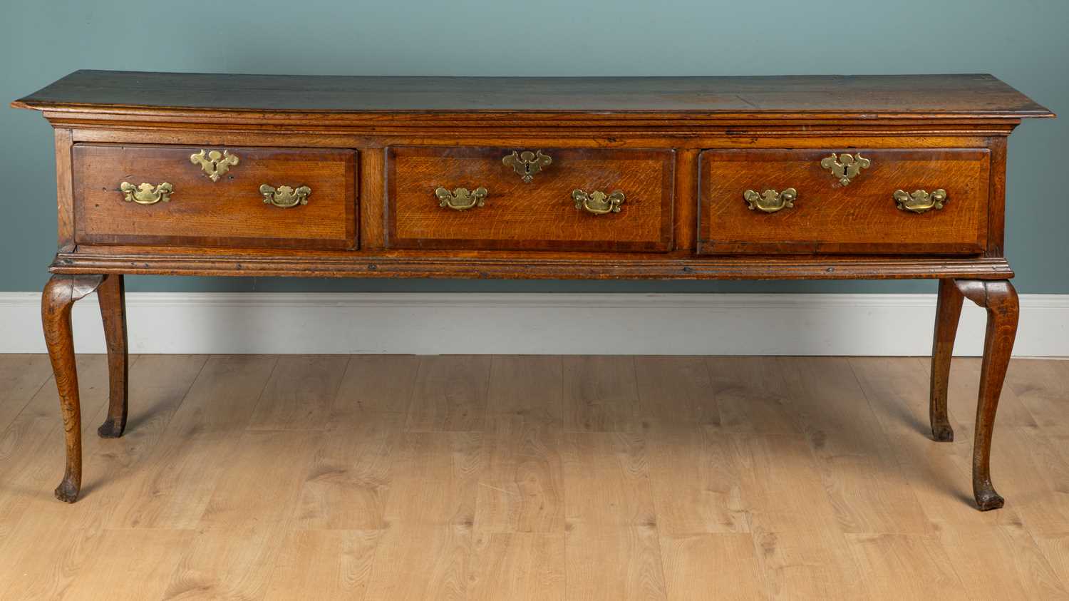 Lot 1016 - A George III oak dresser