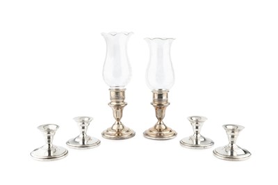 Lot 708 - A pair of American silver candlesticks, with...