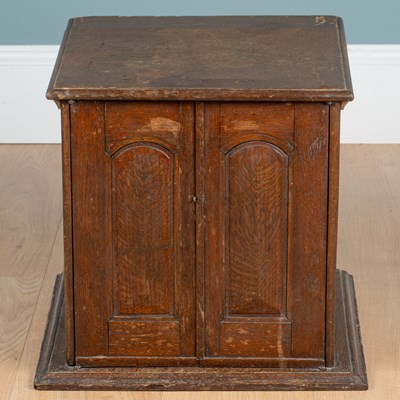 Lot 1255 - An early 20th century oak collectors' cabinet