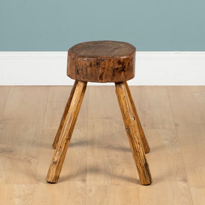 Lot 1128 - A rustic oak stool or chopping block
