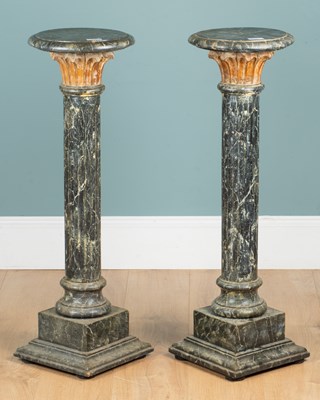 Lot 1113 - A pair of painted wooden torchères