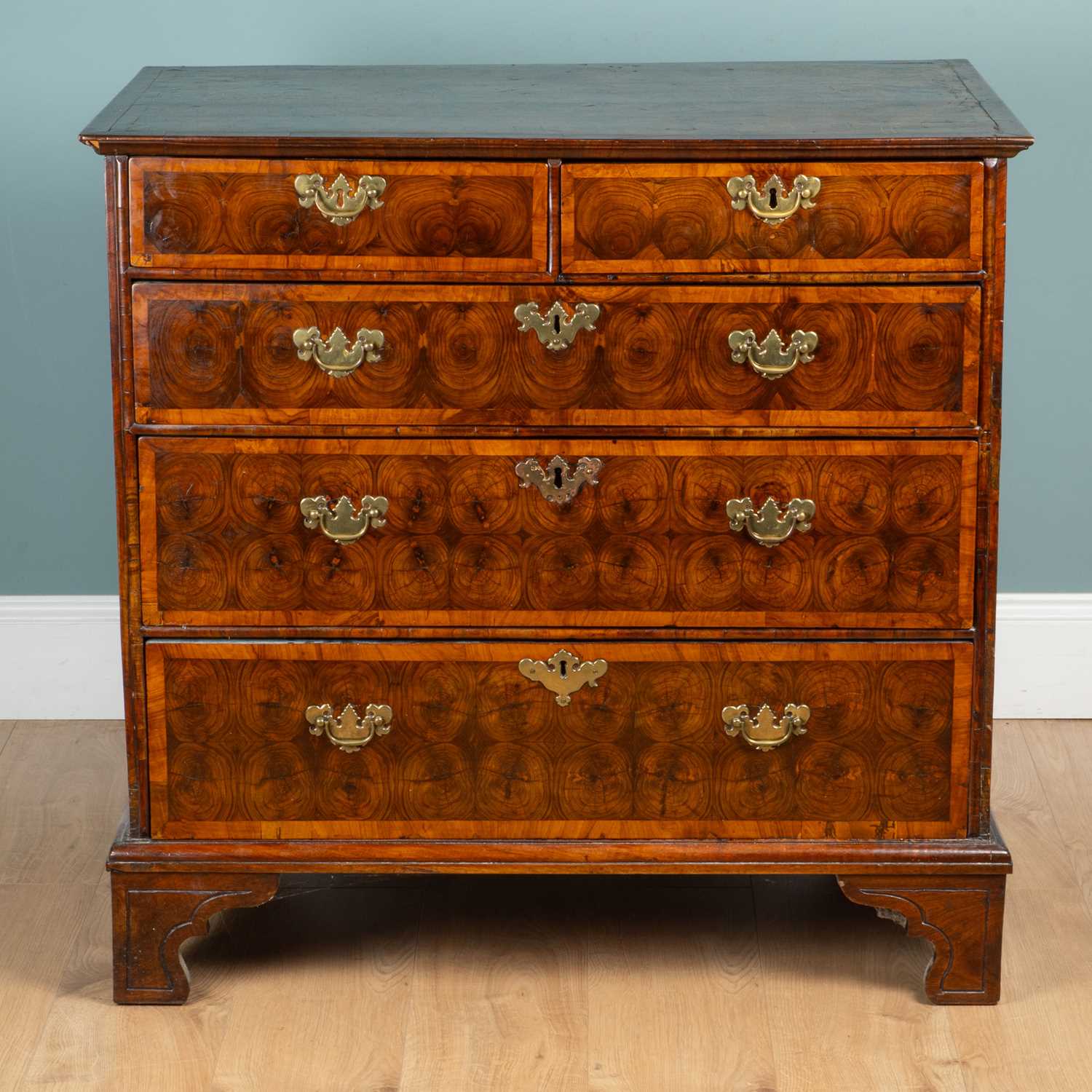Lot 1019 - An early 18th century walnut oyester-veneered chest of drawers