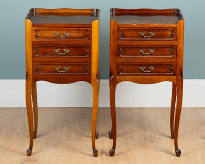 Lot 22 - A pair of French walnut bedside cabinets