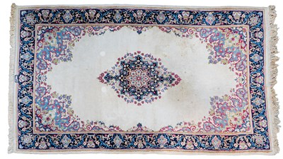 Lot 1228 - A Persian-style rug