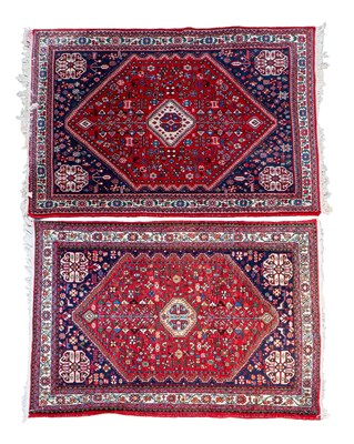 Lot 1047 - A matched pair of Hamadan-style rugs