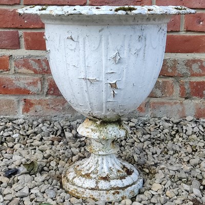 Lot 1447 - A white-painted cast iron urn