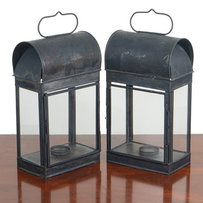 Lot 1466 - A pair of black patinated toleware four-glass candle lanterns