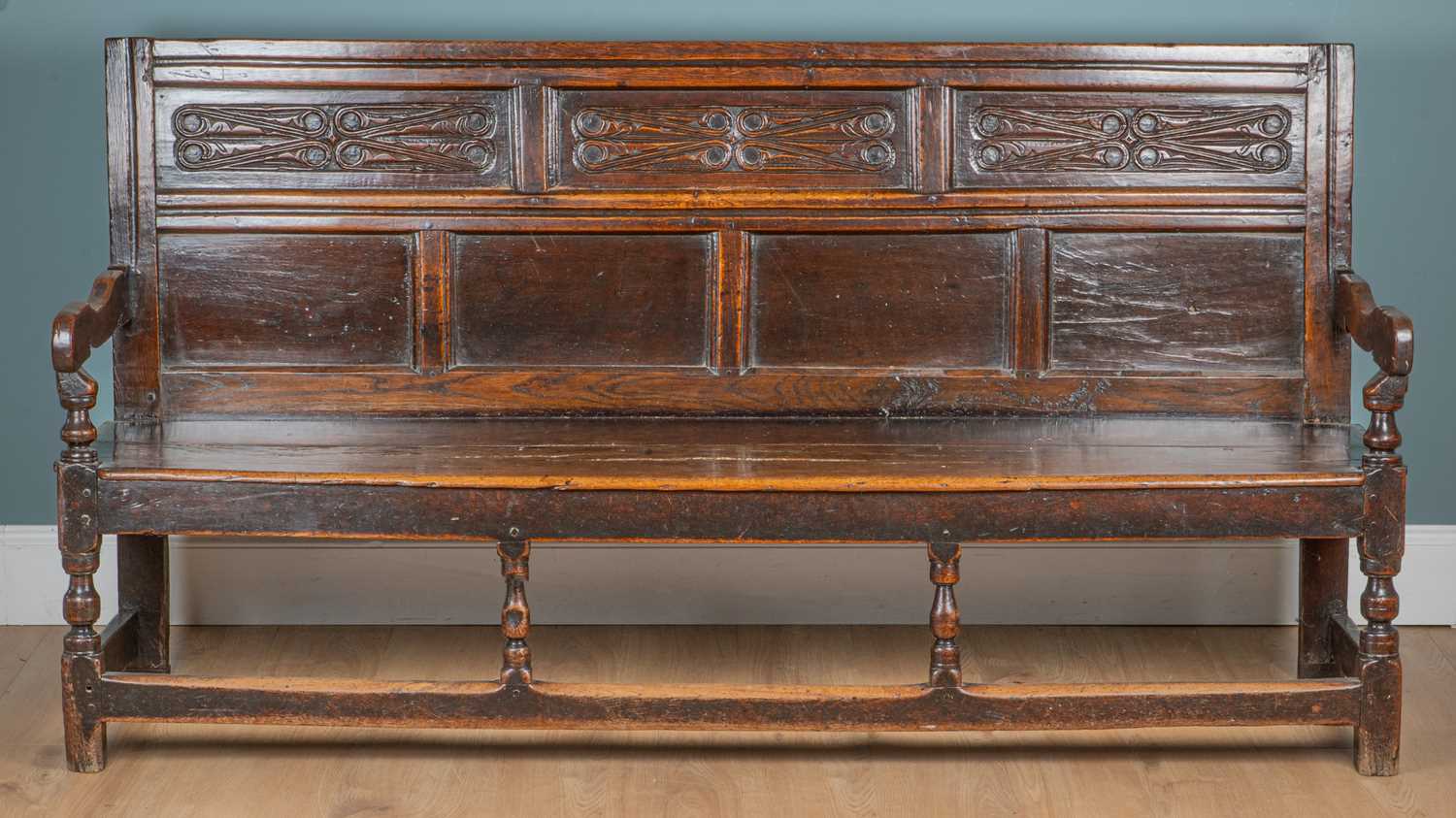 Lot 1233 - An 18th century Lancashire oak settle