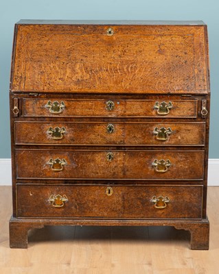 Lot 1169 - A George III oak bureau