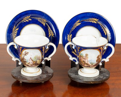 Lot 75 - Pair of Derby twin-handled cups and saucers on stands