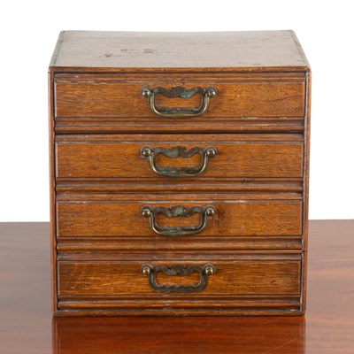 Lot 1154 - An Edwardian oak four-drawer collectors' cabinet by Henry Stone & Sons, Banbury