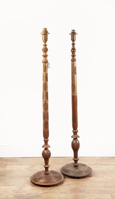 Lot 22 - Two carved hardwood standard lamps Indian,...