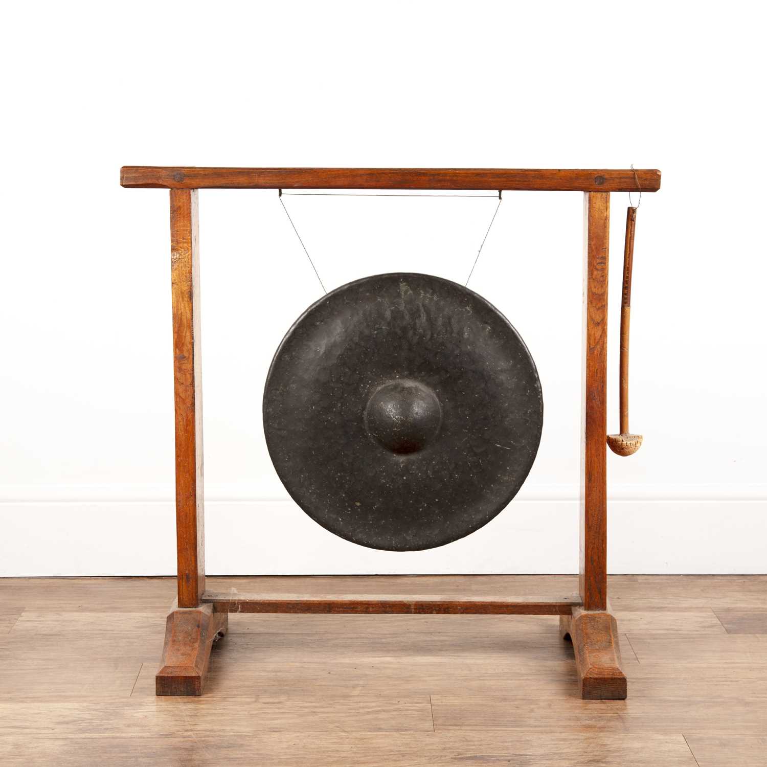Lot 48 - Arts and Crafts oak gong stand with a Tibetan...