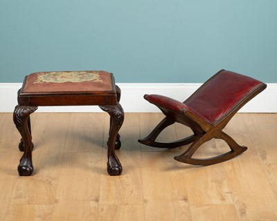Lot 368 - A 19th century oak-framed gout stool, together with a George III-style footstool