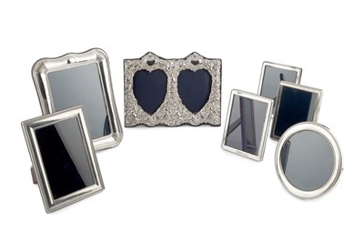 Lot 744 - A silver mounted double photograph frame, the...