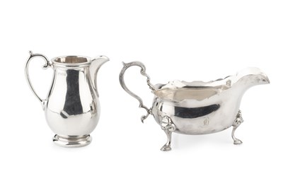 Lot 745 - A George VI silver sauce boat, with shaped...