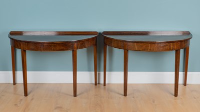 Lot 1320 - A pair of 19th century mahogany demi-lune console tables