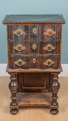 Lot 1214 - An 18th century oak and elm serpentine-fronted chest on stand