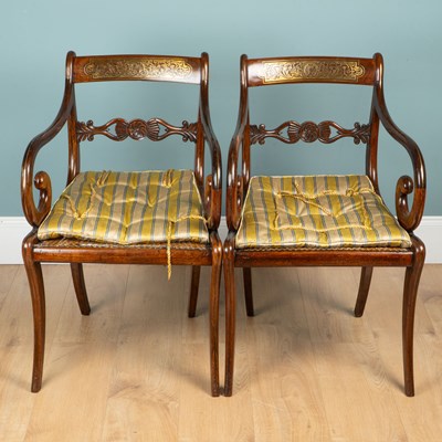 Lot 1357 - A pair of Regency mahogany elbow chairs